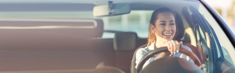 women driving car