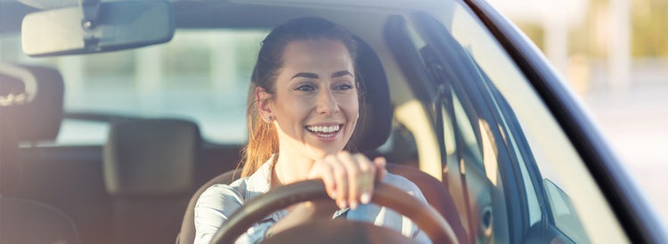 women driving car
